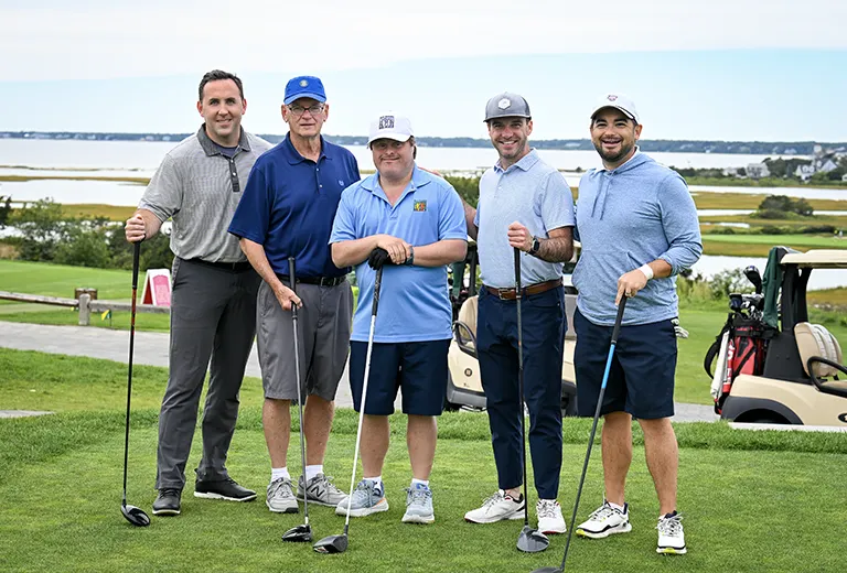 Group of golfers with a Best Buddies Participant