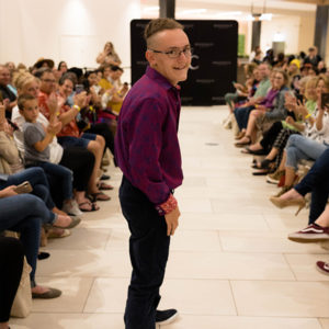 Best Buddy participant walking the runway