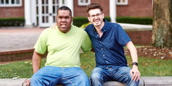 Best Buddies Citizens pair smiling outside