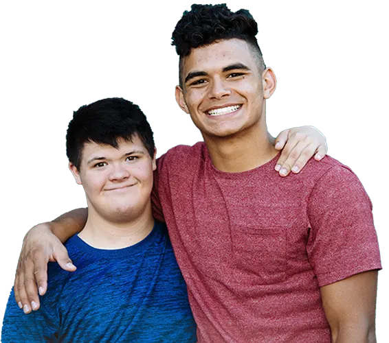 Two male Best Buddies participants with their arms over each other's shoulder