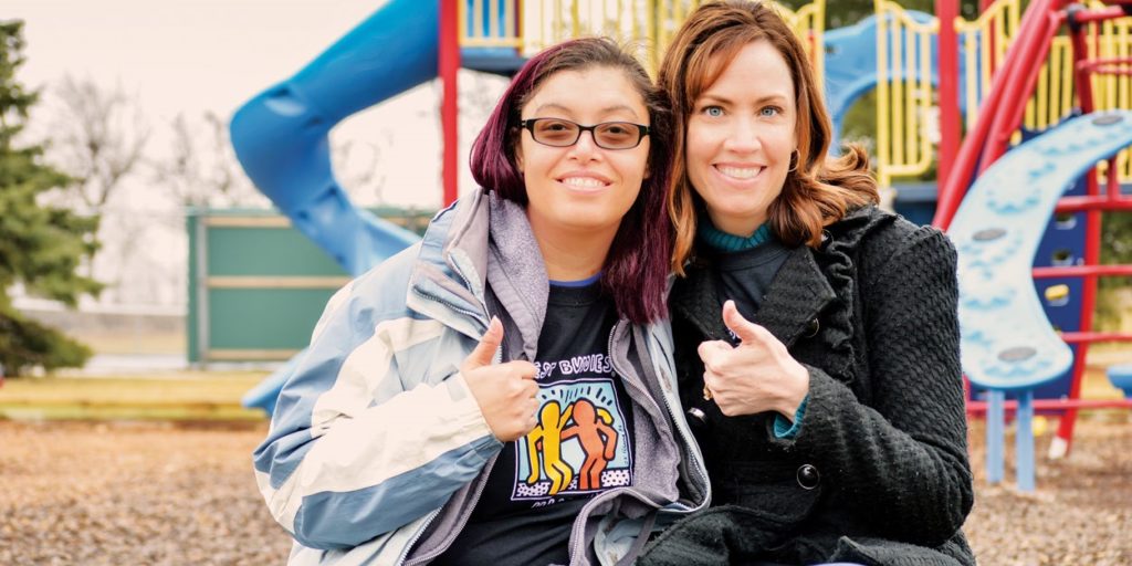 Best Buddies participants giving a thumbs up