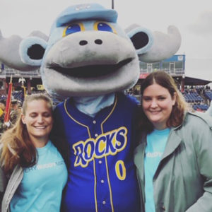 Best Buddies buddies Celeste and Vallerie posing with the Blue Rocks Mascot at Frawley Stadium