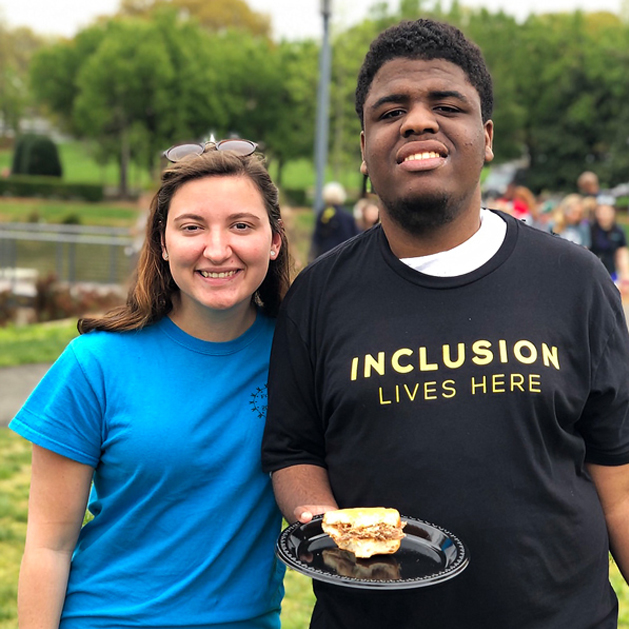 Two friends smiling at a Best Buddies Firendship Walk Event.