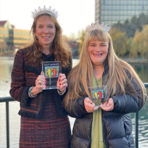 Samantha Terres and her campaign manager Weslyn Hyman holding their Champion of the Year awards