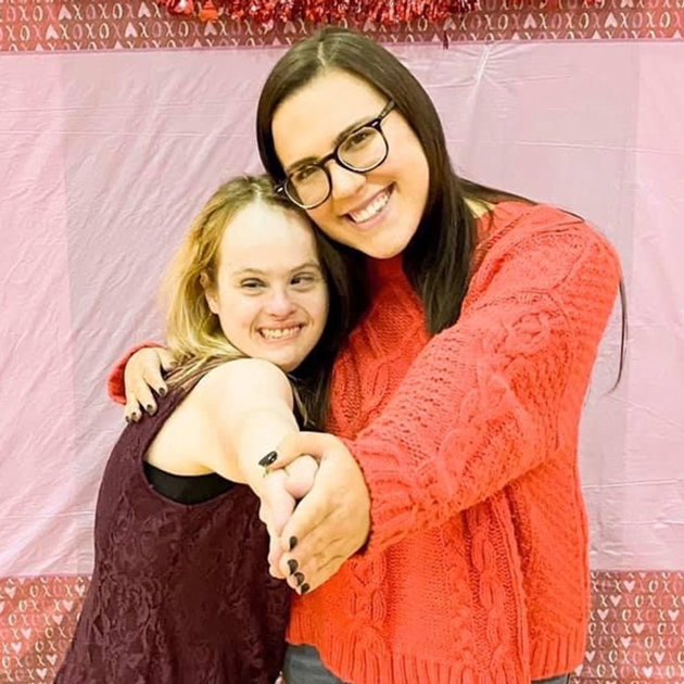 Buddy Pair participants matched in 2019, Olivia DeCaria and Sydney hugging and smiling Buddy Pair participants matched in 2019, Olivia DeCaria and Sydney hugging and smiling