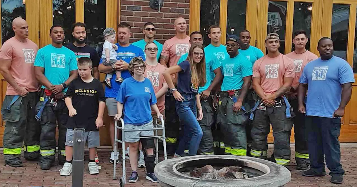 Large group of firefighters with Best Buddies participants
