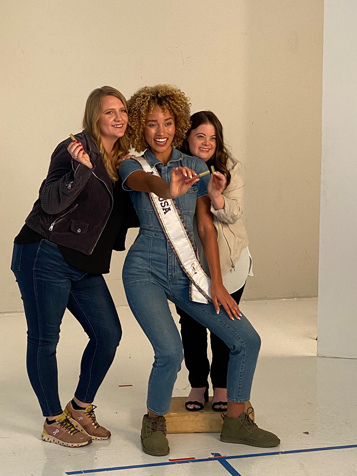 Miss USA 2021, Elle Smith, poses with models from Smile Train and Best Buddies Internationnal for the Miss USA LipSense® Collection Campaign.