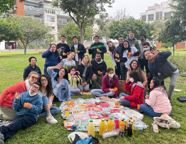 Best Buddies in the Peru participants gather for an outdoor picnic.