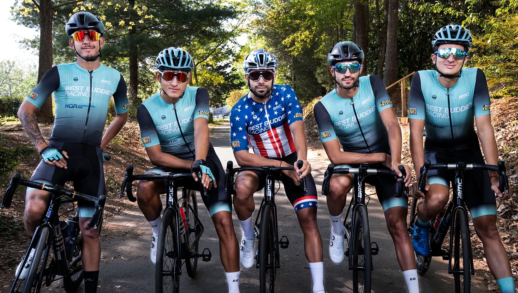 Four Best Buddies Racing Team members on their bikes.