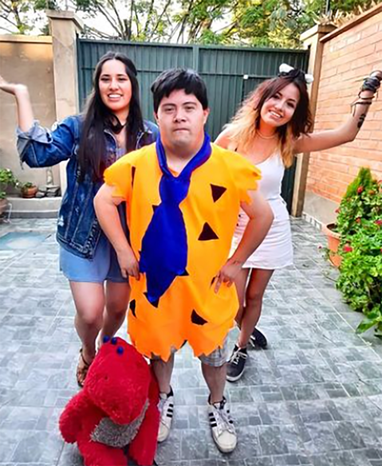 A Best Buddies in Bolivia particpant is seen in a Fred Flintstone costume for a costume party.