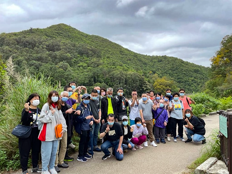 Kwai Hing Vocational Development Centre & Citizens Buddies Chapter Friendship Walk participants pose for an outdoor group photo.