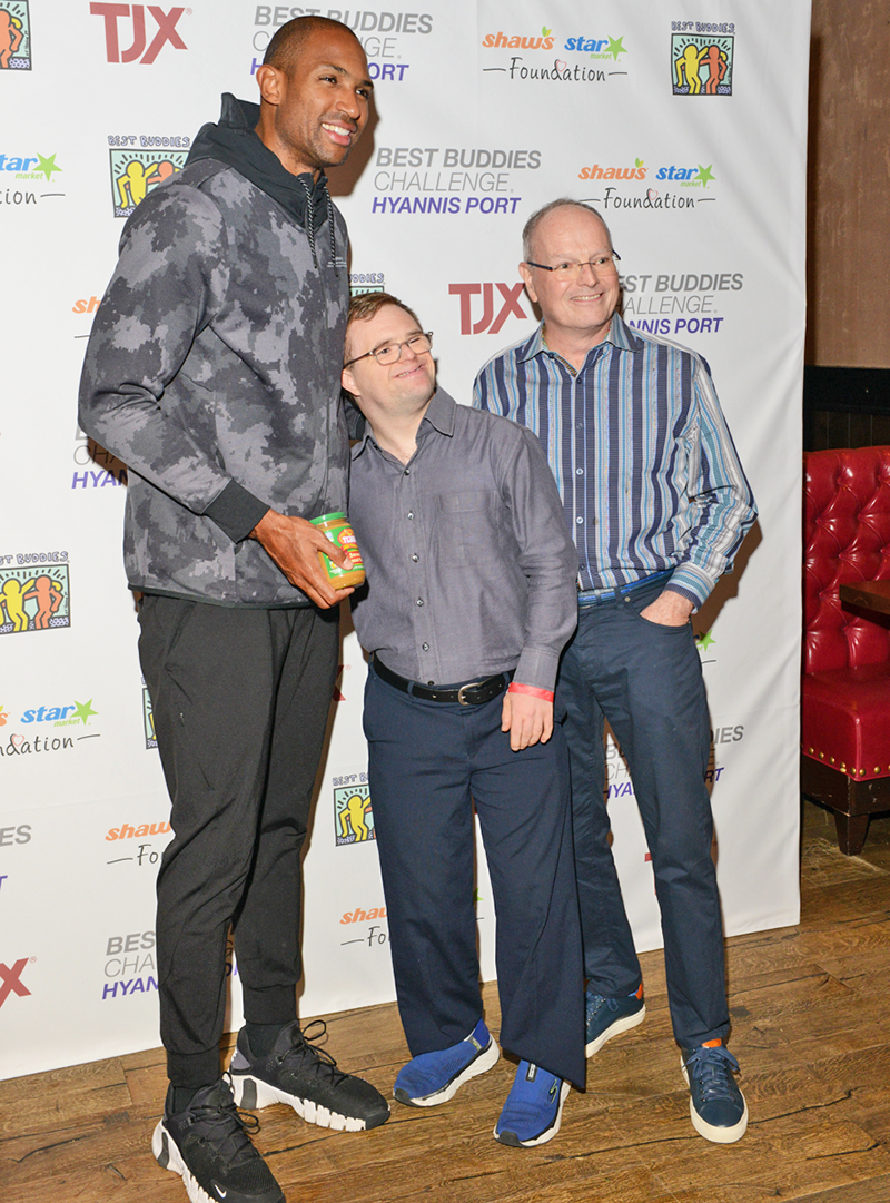 Al Horford, the Boston Celtics’ five-time NBA All-Star center is seen with two male Best Buddies program participants.