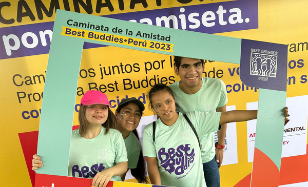 Four Best Buddies Peru participants share a photo booth during an event.