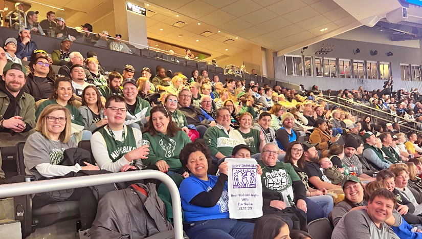 Participants in the stands of the Milwaukee Bucks arena