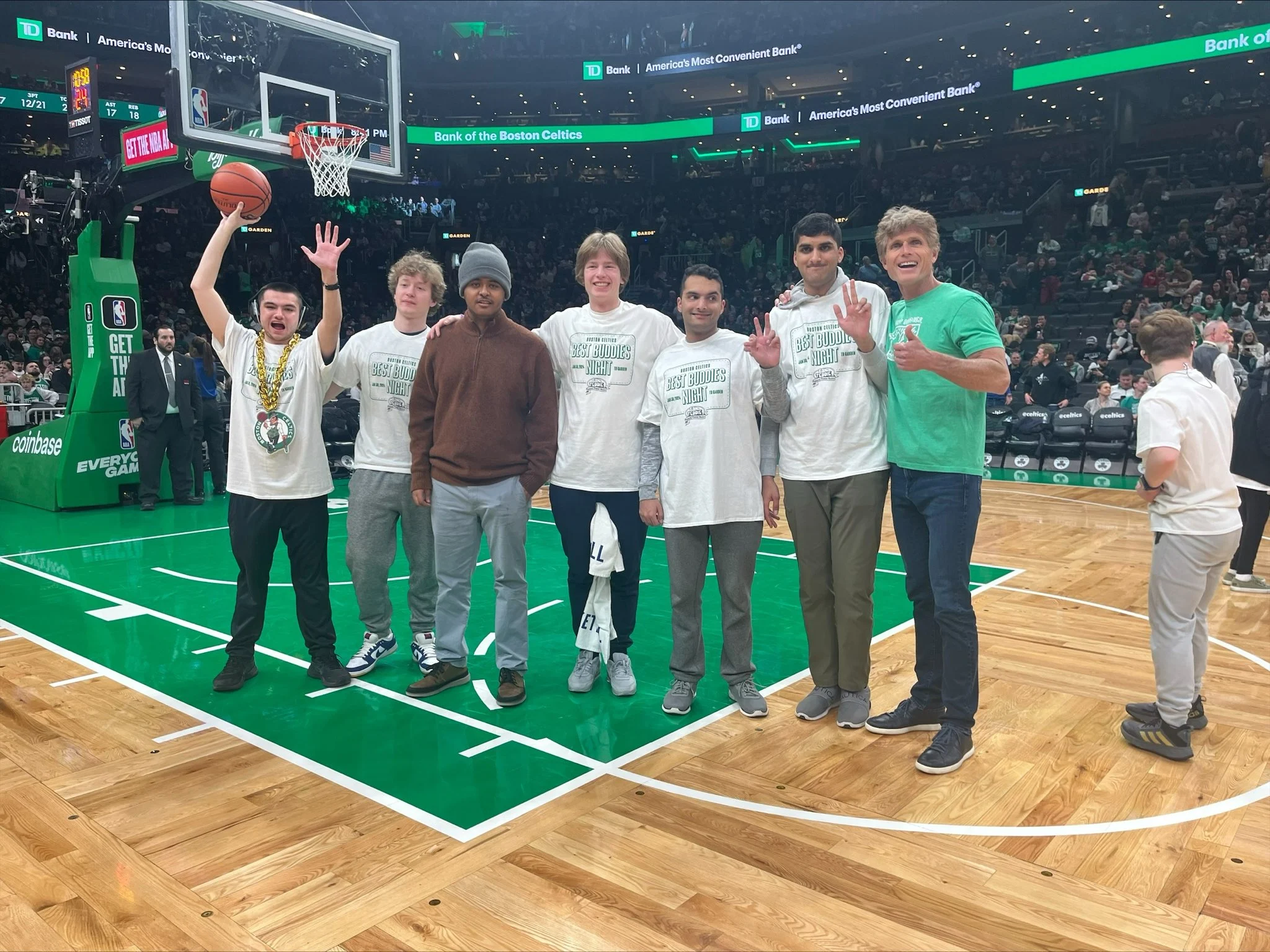 Anthony K. Shriver (right) and Best Buddies participants at the Celtics game.