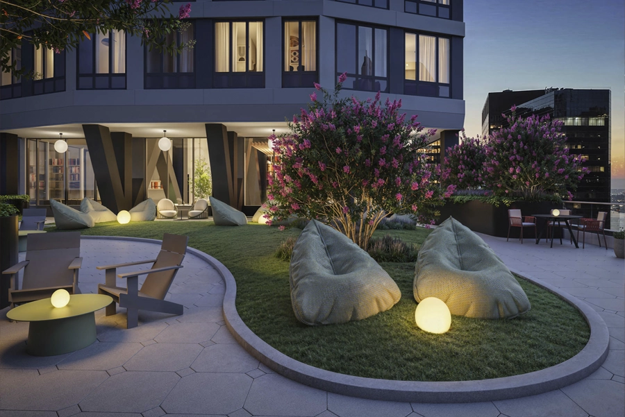 Living - NY, NY SoMA Courtyard Landscaped rooftop courtyard with seating, bean bags, and lounge area at modern NYC apartment building.