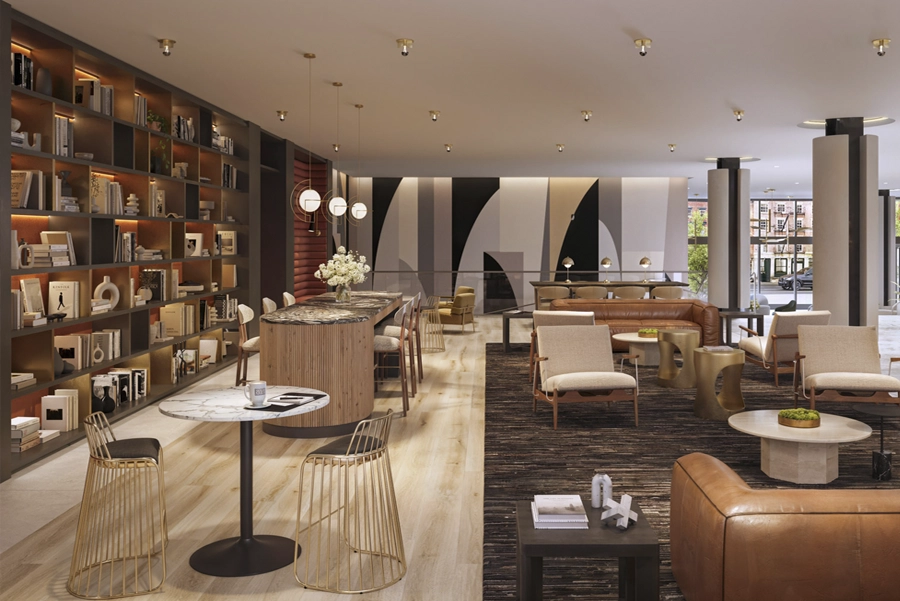 Living - NY, NY SoMA sitting area Modern resident lounge with seating, tables, and library-style shelving in apartment building.