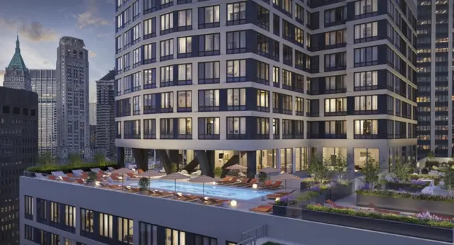 Living - NYC - soMA Feature Image Modern high-rise apartment building with rooftop pool, lounge seating, and city skyline views in New York City.