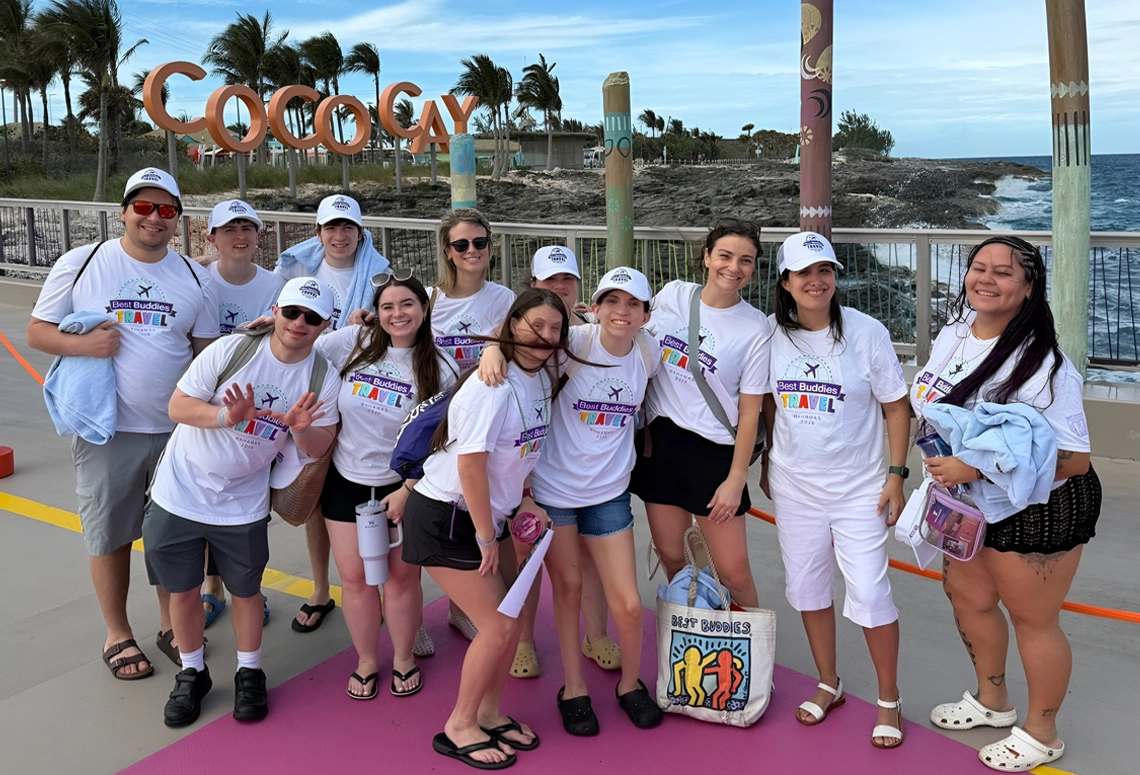 Group of Best Buddies participants posing together at CocoCay during a travel experience.