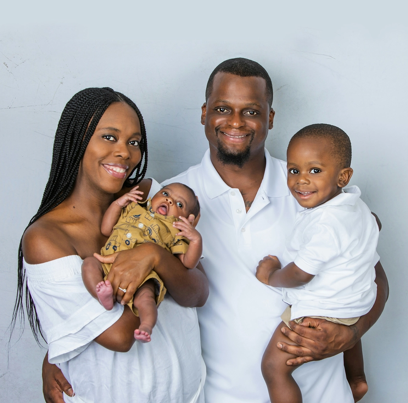 Family smiling together, representing support and connection.